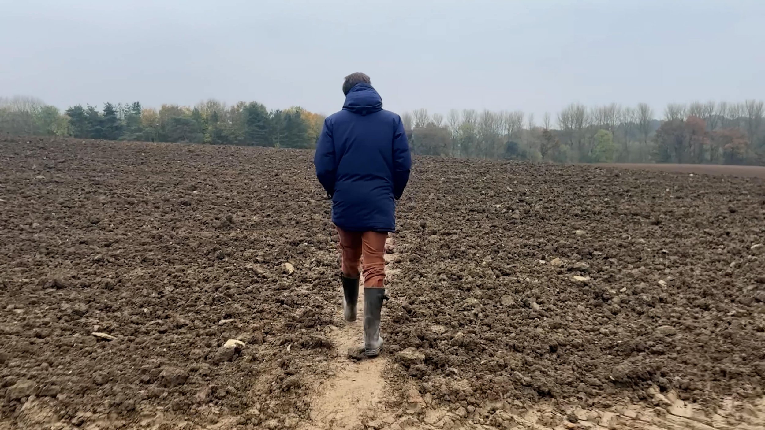 Man walking in the countryside in the Cotswolds .jpg